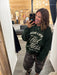 Green varsity Mom sweatshirt from Quotes + Cotton clothing boutique in Burlington, WI.